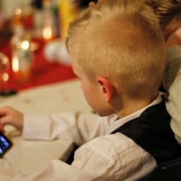 Boy on phone during dinner
